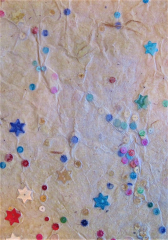 Oiled lokta paper from Nepal, embedded with star & metallic confetti on cream background