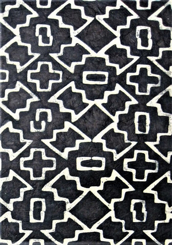 Oiled lokta paper from Nepal, translucent wax design on black background