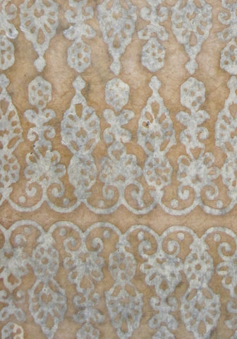 Oiled lokta paper from Nepal, translucent wax design on ochre background