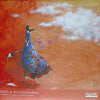 Artistic depiction of a woman in a blue dress with a colorful pattern, set against an orange sky with clouds, on a calendar cover for 2026 by Gaèlle Boissonnard.