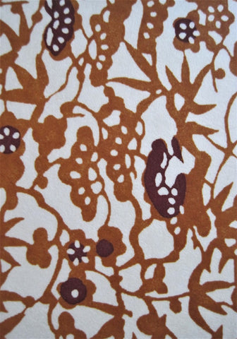 Close-up of Japanese chiyogami paper cadmium orange pattern on cream