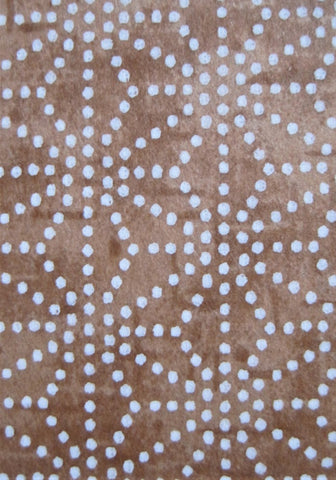 Close-up of Japanese chiyogami paper white dots on shades of brown in geometric pattern
