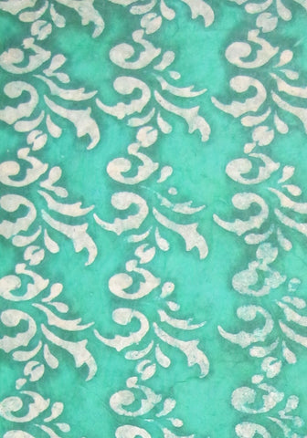 Oiled lokta paper from Nepal, translucent wax design on green background