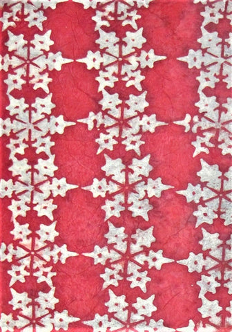 Oiled lokta paper from Nepal, translucent wax design on red background