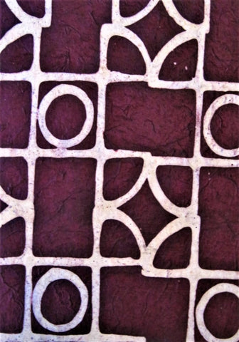 Oiled lokta paper from Nepal, translucent wax design on burgandy maroon background